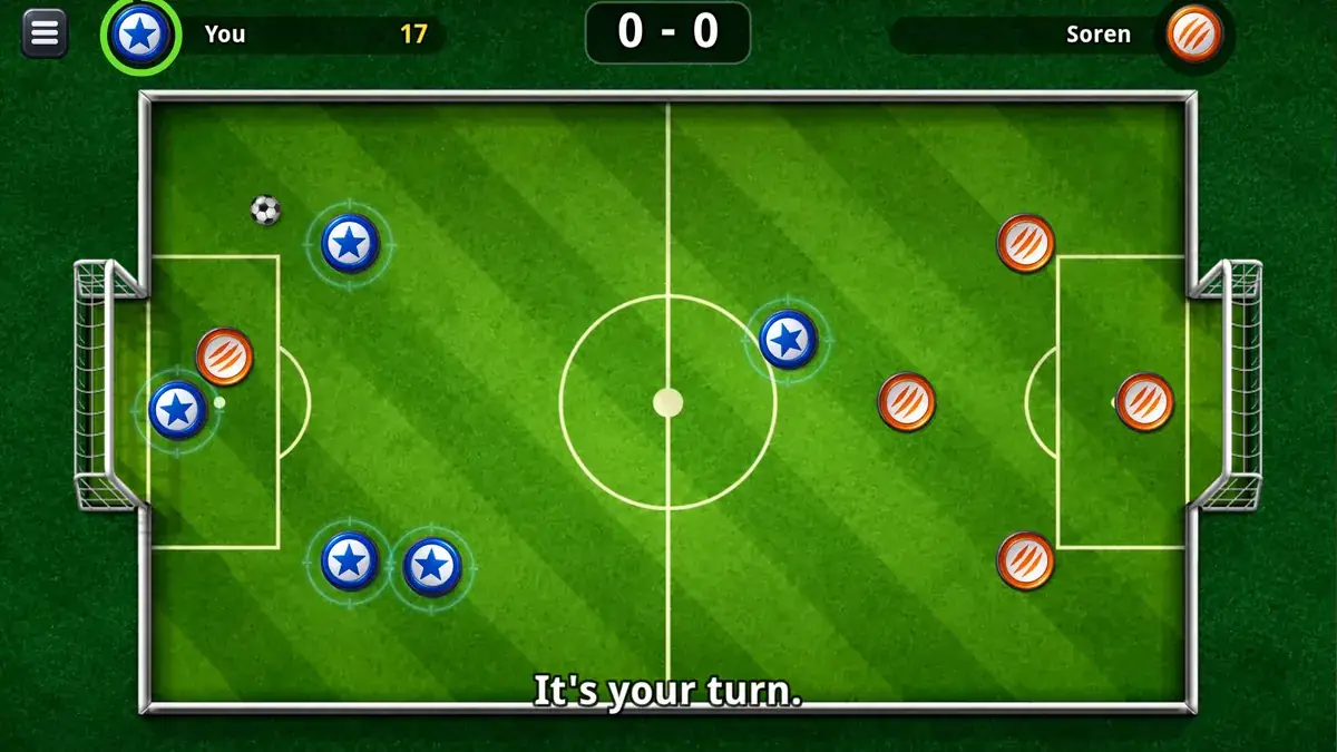 Soccer Kick gameplay: blue and red discs lined up on a green pitch at kick-off